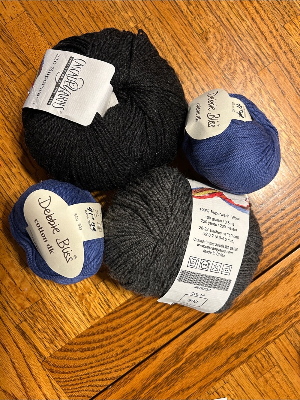2 skeins 100% wool and 2 100% cotton